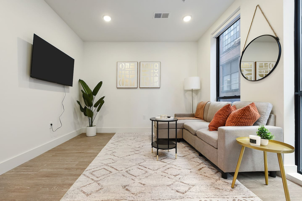 You feel at home as you settle into the living room, where the inviting atmosphere is perfect for lounging or entertaining.