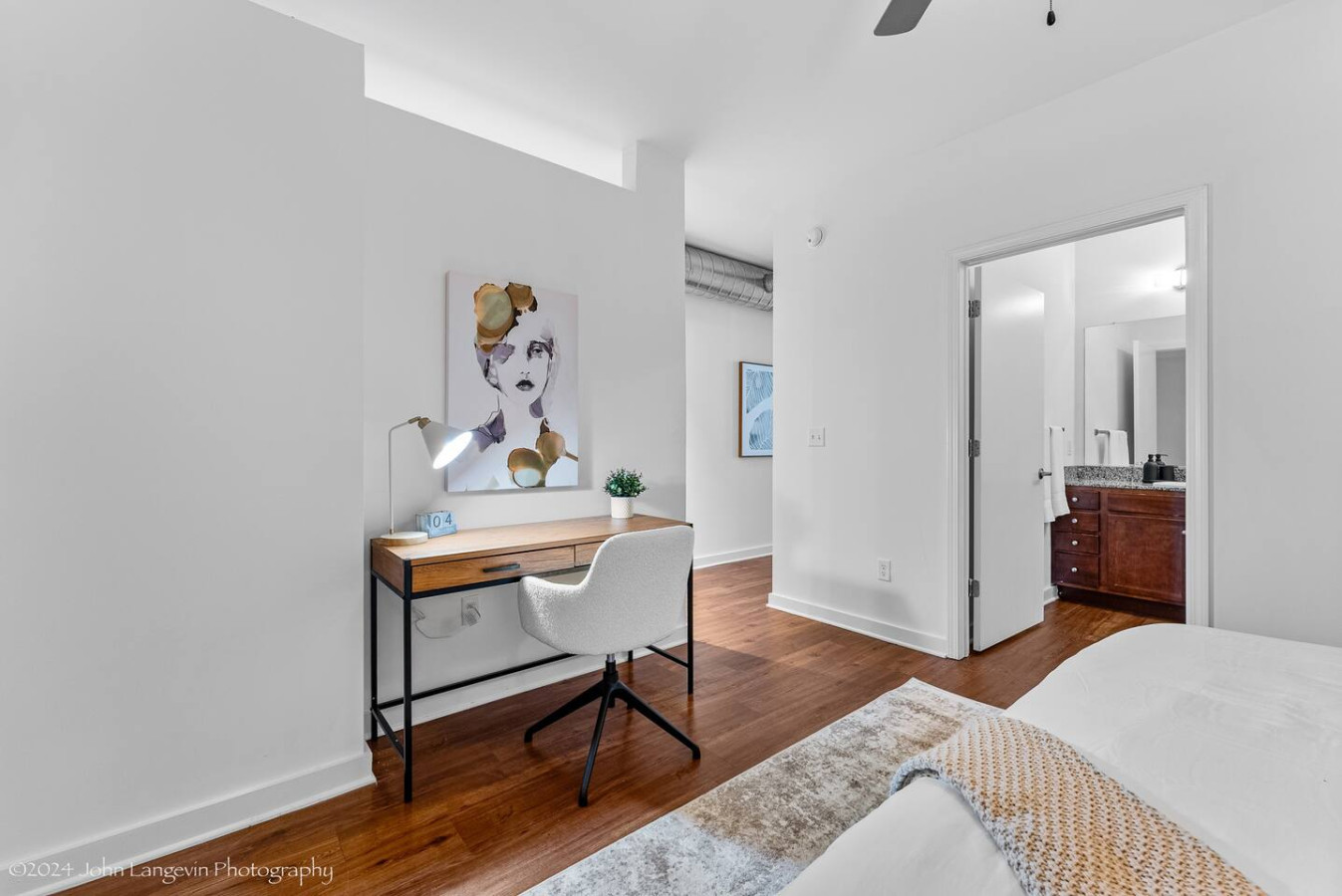 The bedroom offers a luxurious retreat, with a bed that promises restful nights and a room that feels like a private oasis.