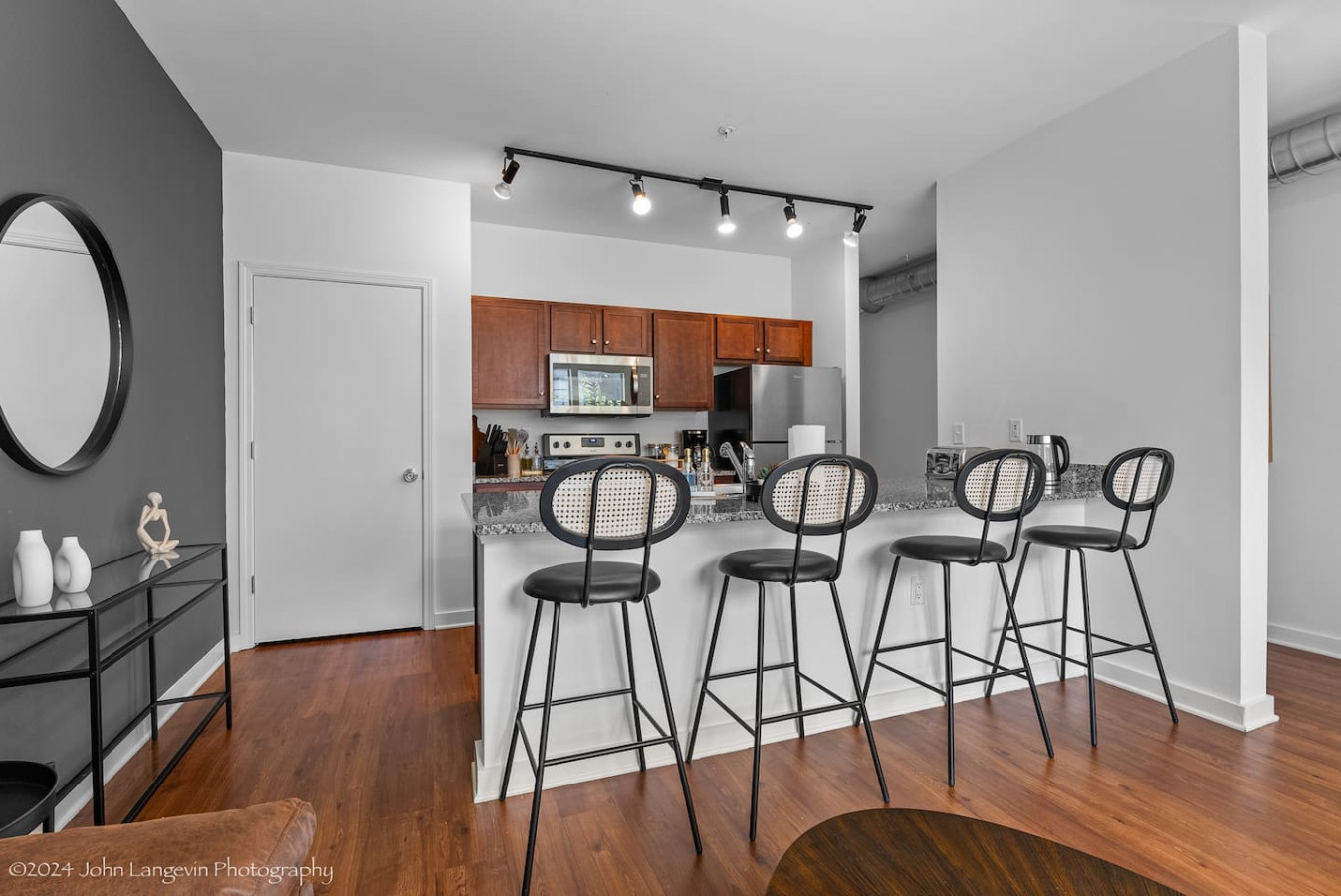Elegant dining area with a large table and comfortable seating, perfect for gathering with family and friends for a meal.