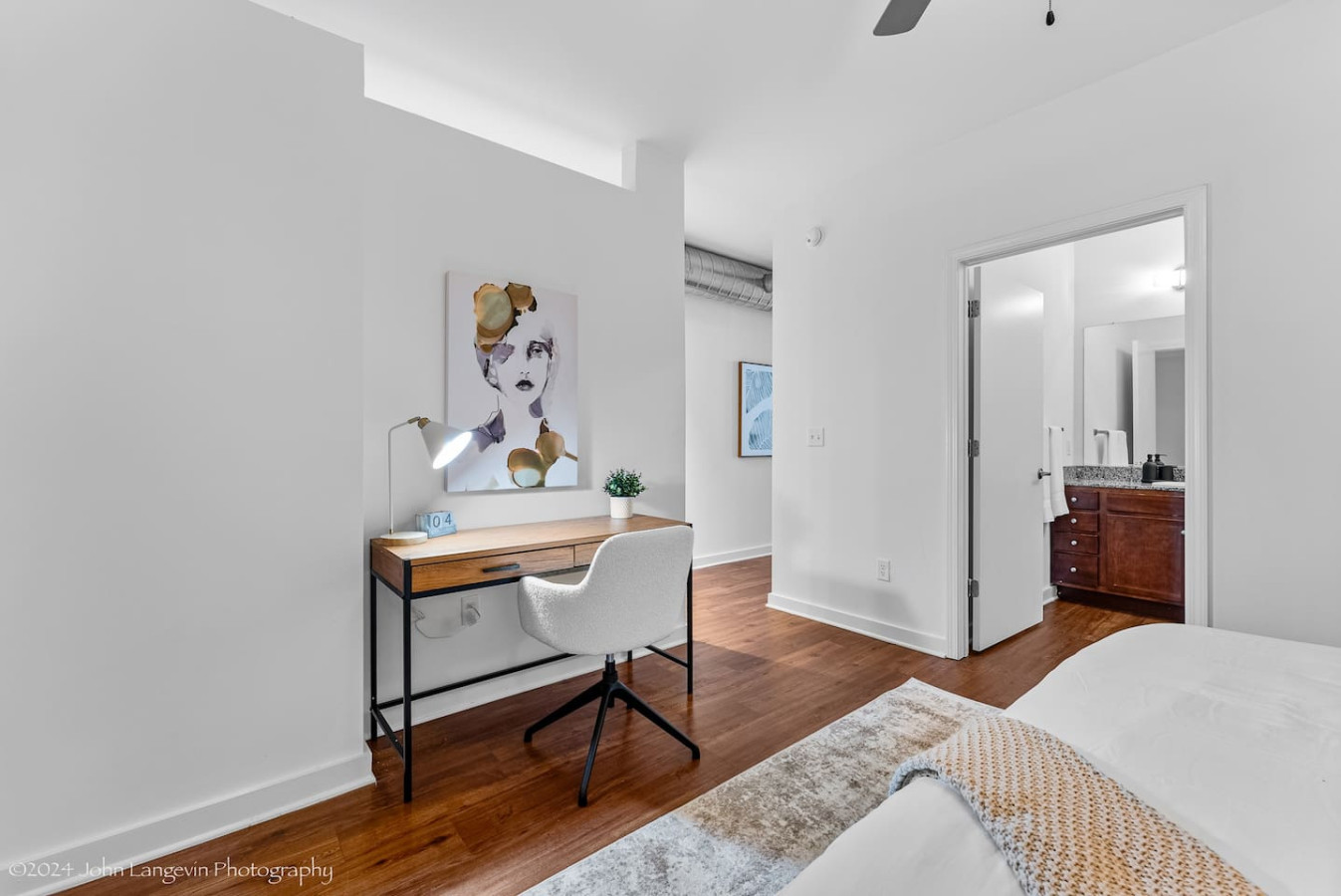 This cozy workspace in the master bedroom is perfect for productivity. Enjoy natural light, a comfortable chair, and a stylish desk setup. Ideal for work-from-home needs or planning your Dallas adventures.