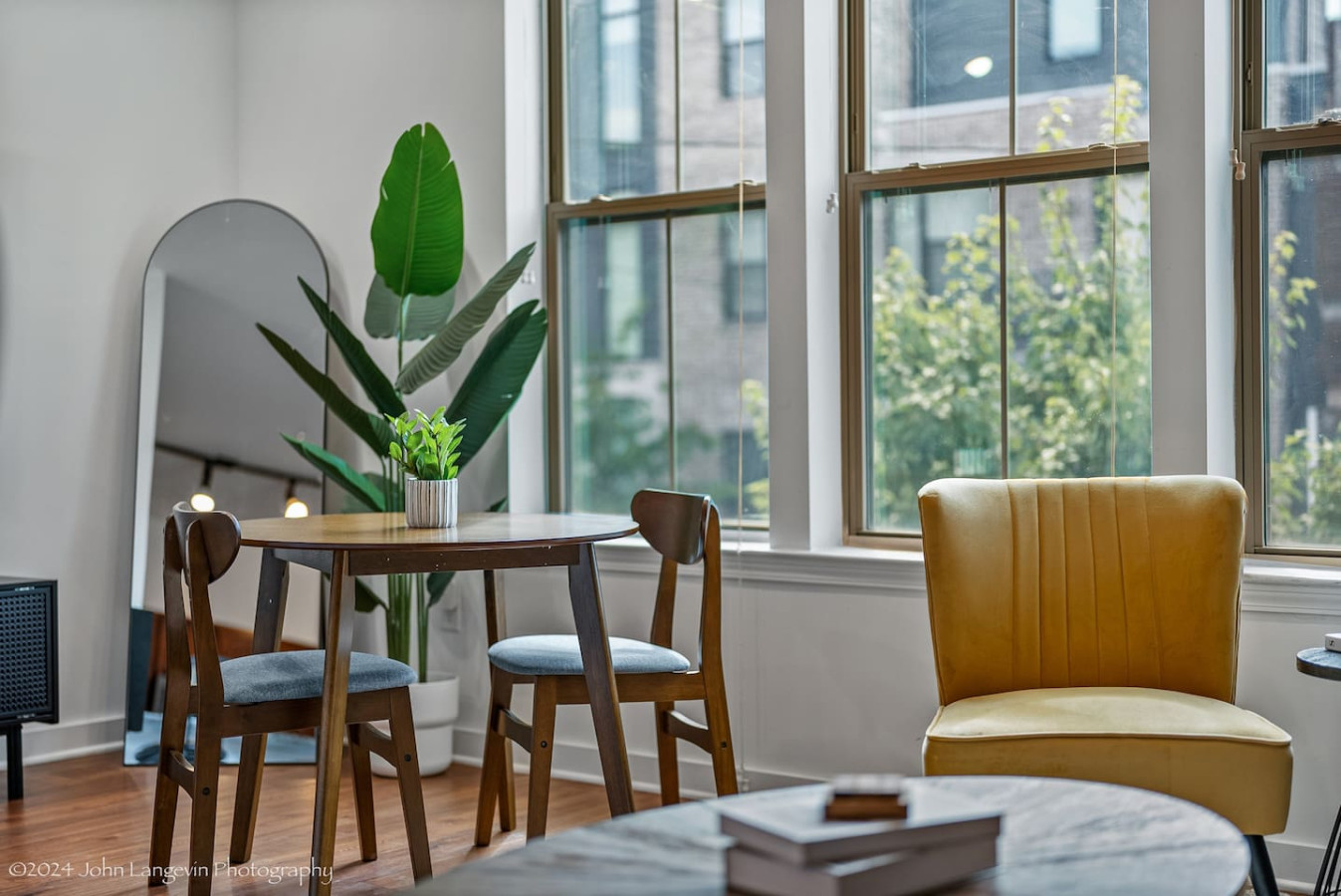 Elegant dining area with a large table and comfortable seating, perfect for gathering with family and friends for a meal.