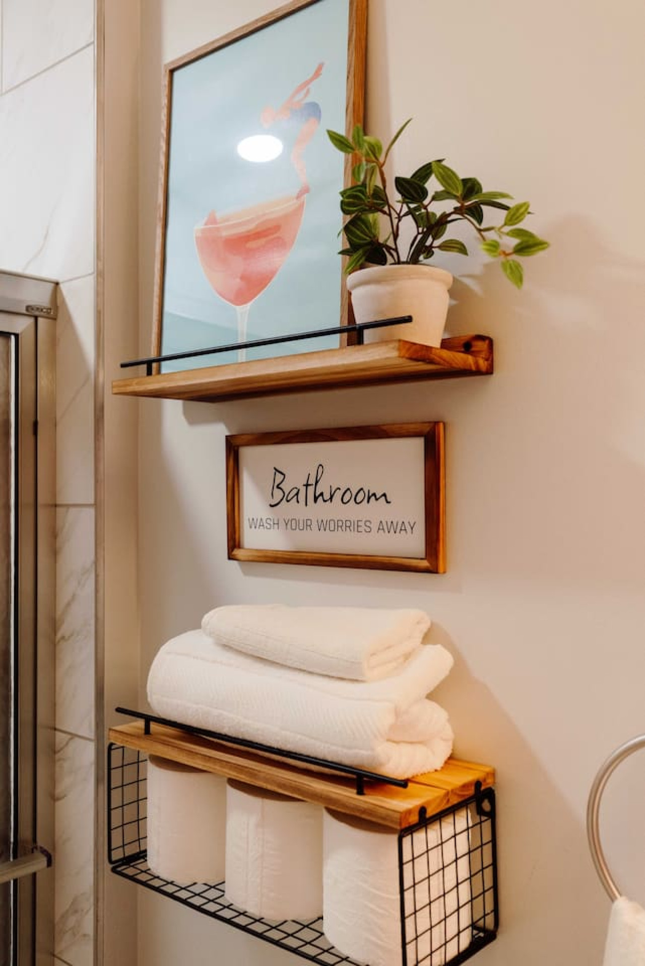 Immaculate bathroom featuring a spacious shower, fresh towels, and complimentary toiletries for a spa-like experience.
