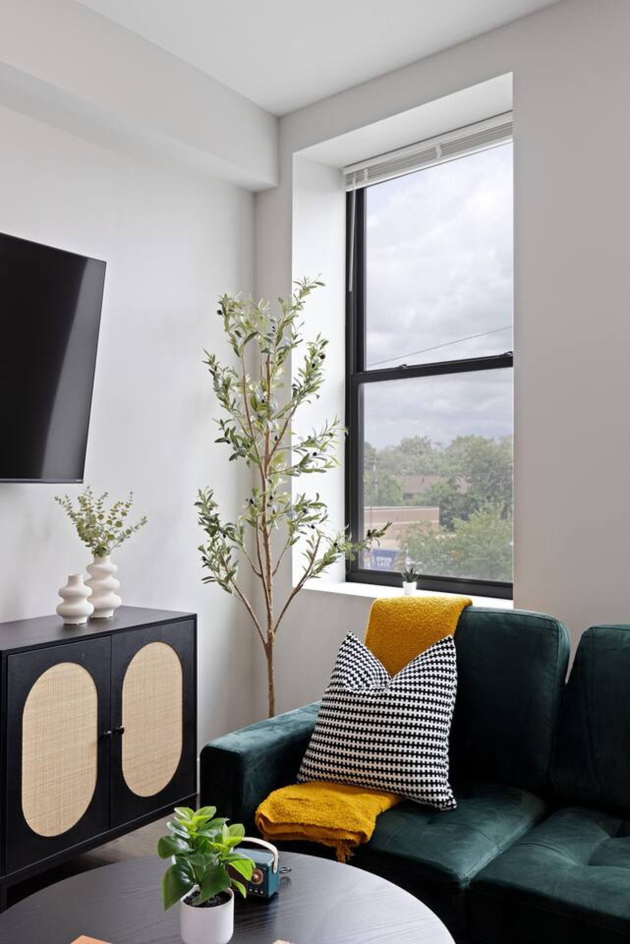 You feel a sense of peace as you step into the living room , with its inviting decor and soothing tones.