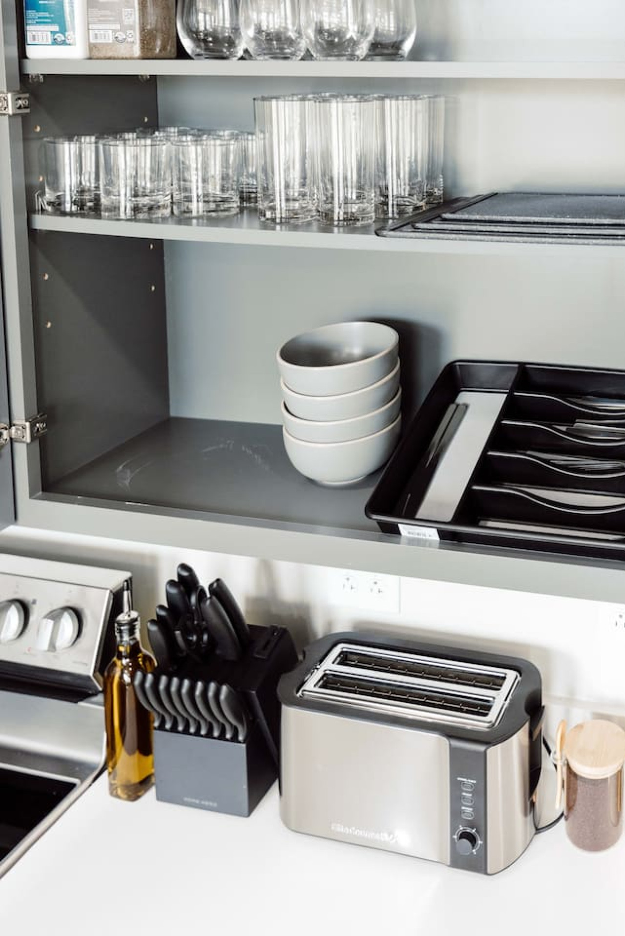 Cook with ease in this well-equipped kitchen featuring stainless steel appliances, ample cabinetry, and a stylish backsplash. Whether you're brewing coffee or preparing a gourmet meal, this space is designed for functionality and style, making every meal