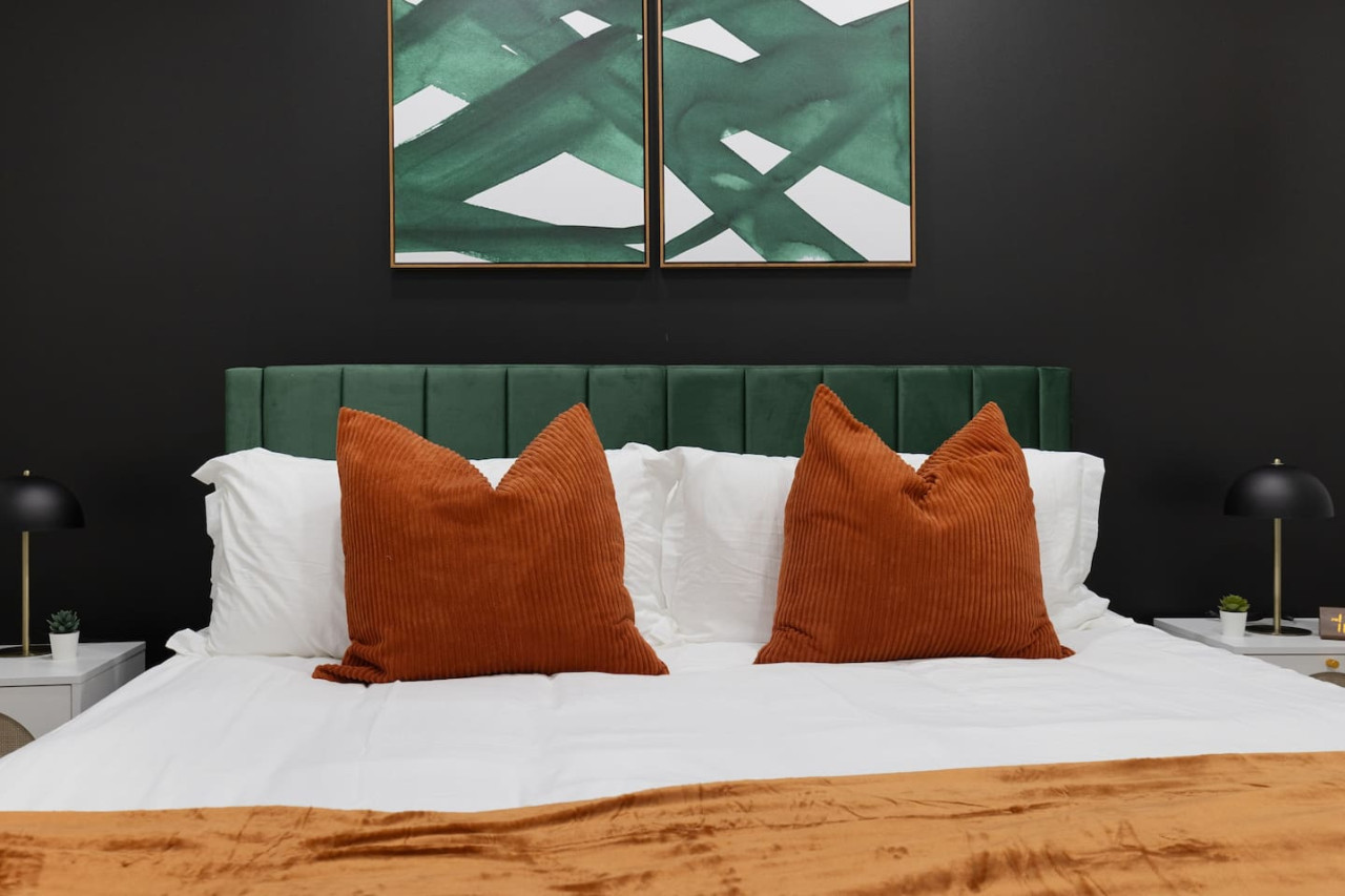 The bedroom’s serene ambiance invites you to relax, with a plush bed that promises a restful night's sleep.