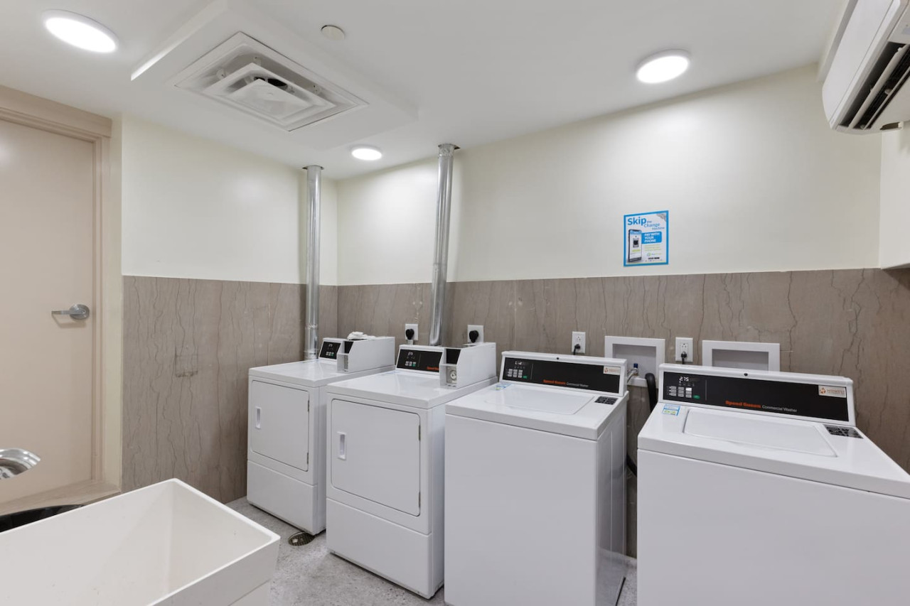 Convenient laundry room with washer, dryer, and all necessary supplies, making it easy to take care of your laundry needs.
