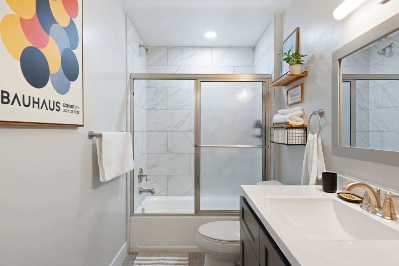 Experience a spa-like retreat in this beautifully appointed bathroom, featuring a full tub, modern fixtures, and thoughtful details. Refresh and rejuvenate with our luxury toiletries and plush towels.