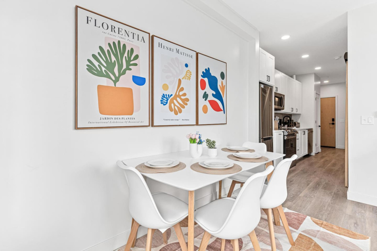 Dining table w/ 4 Place settings - 4 Chairs - Wall Art - Area rug - Easy access to Kitchen