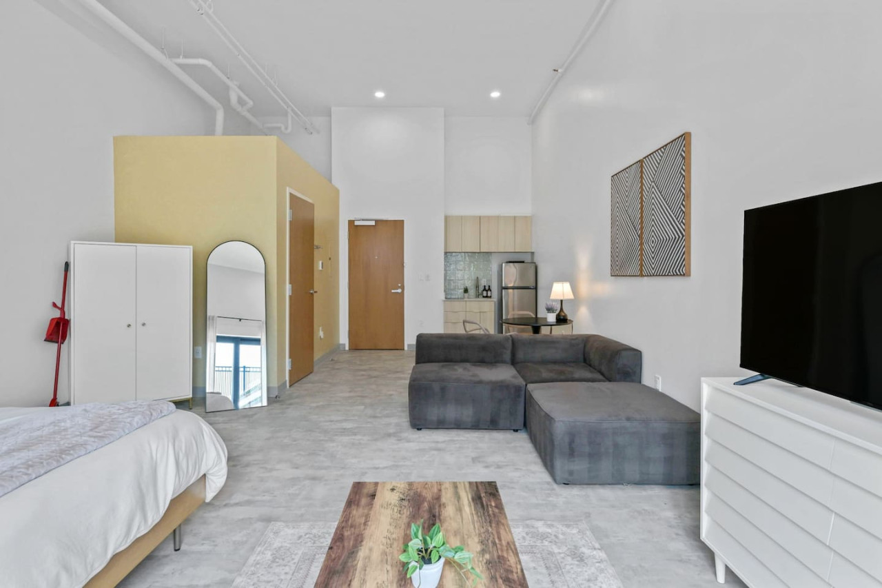 An open-concept area featuring a modern furnishings, and a stylish entertainment setup—ideal for gatherings and relaxation.