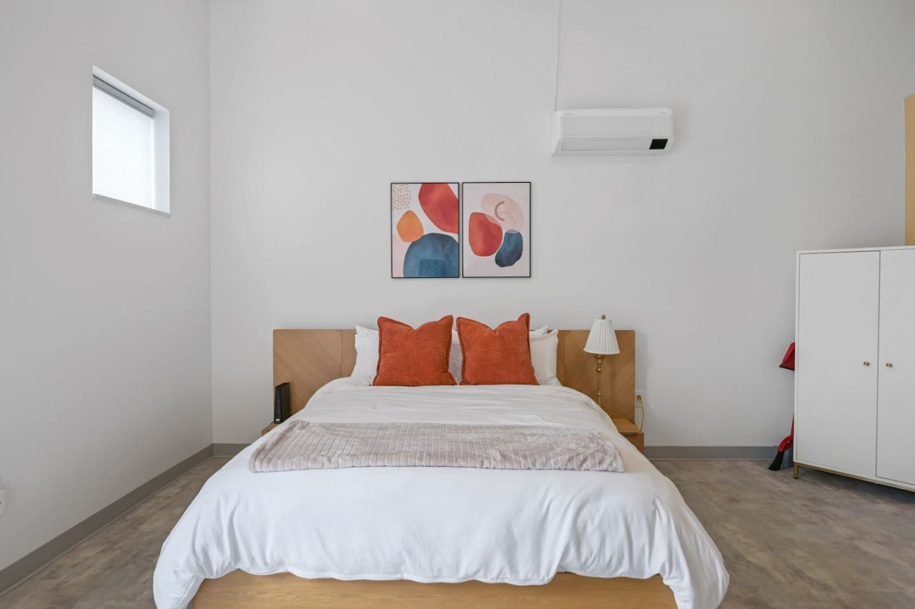 The bedroom’s serene ambiance invites you to relax, with a plush bed that promises a restful night's sleep.