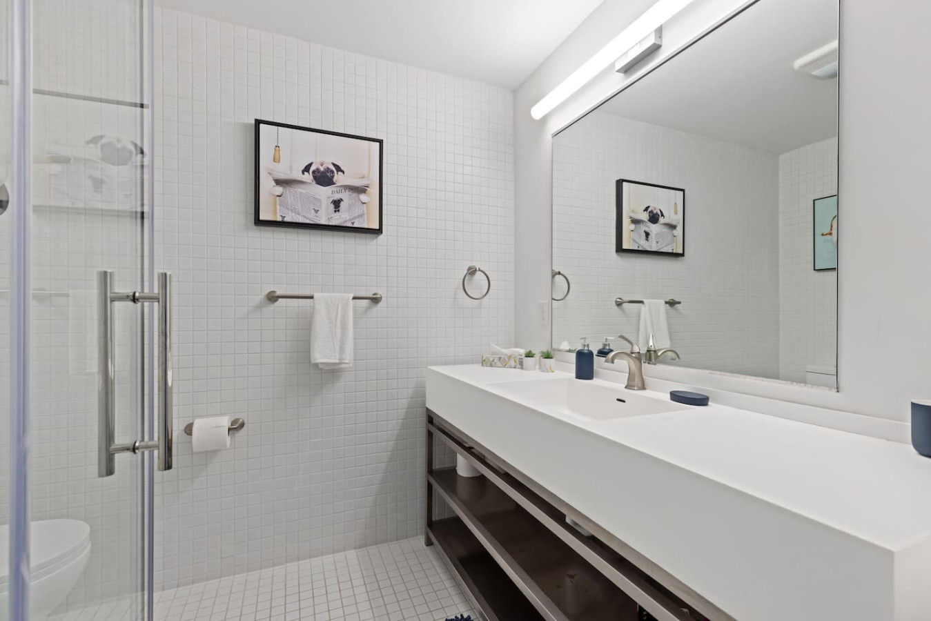 You feel a sense of calm as you enter the bathroom, where the thoughtful design and high-quality materials create a serene environment.