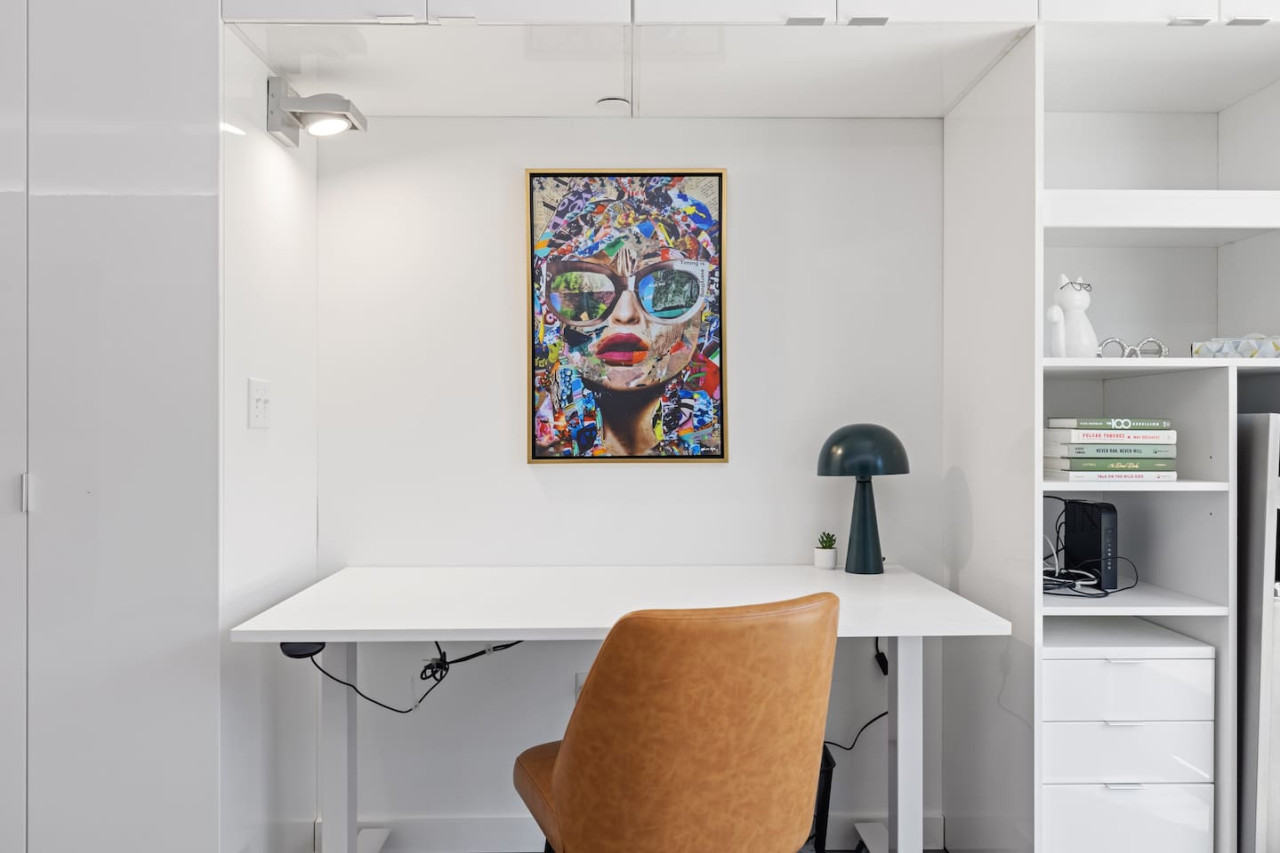 This cozy workspace area is perfect for productivity. Enjoy natural light, a comfortable chair, and a stylish desk setup. Ideal for work-from-home needs or planning your Dallas adventures.
