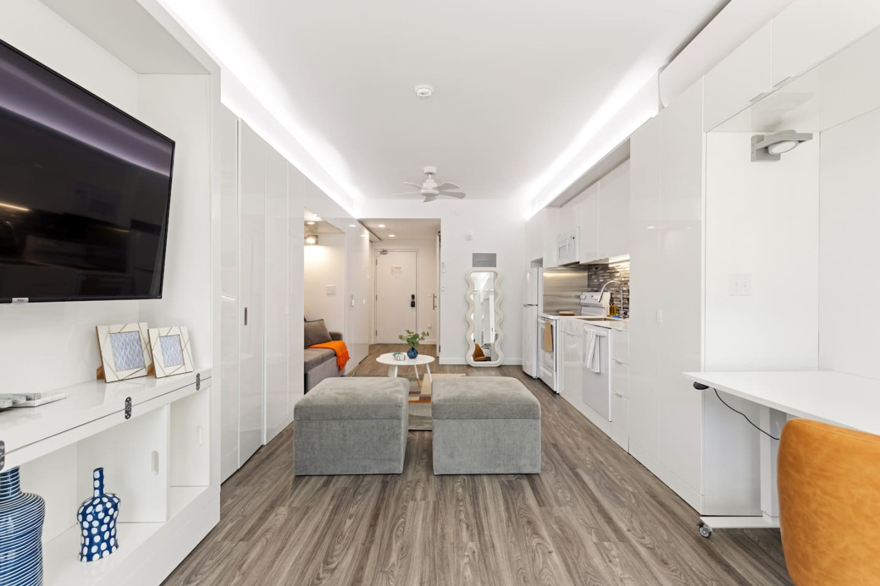 An open-concept area featuring a modern furnishings, and a stylish entertainment setup—ideal for gatherings and relaxation.