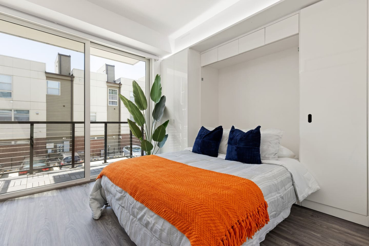 The bedroom offers a luxurious retreat, with a bed that promises restful nights and a room that feels like a private oasis.