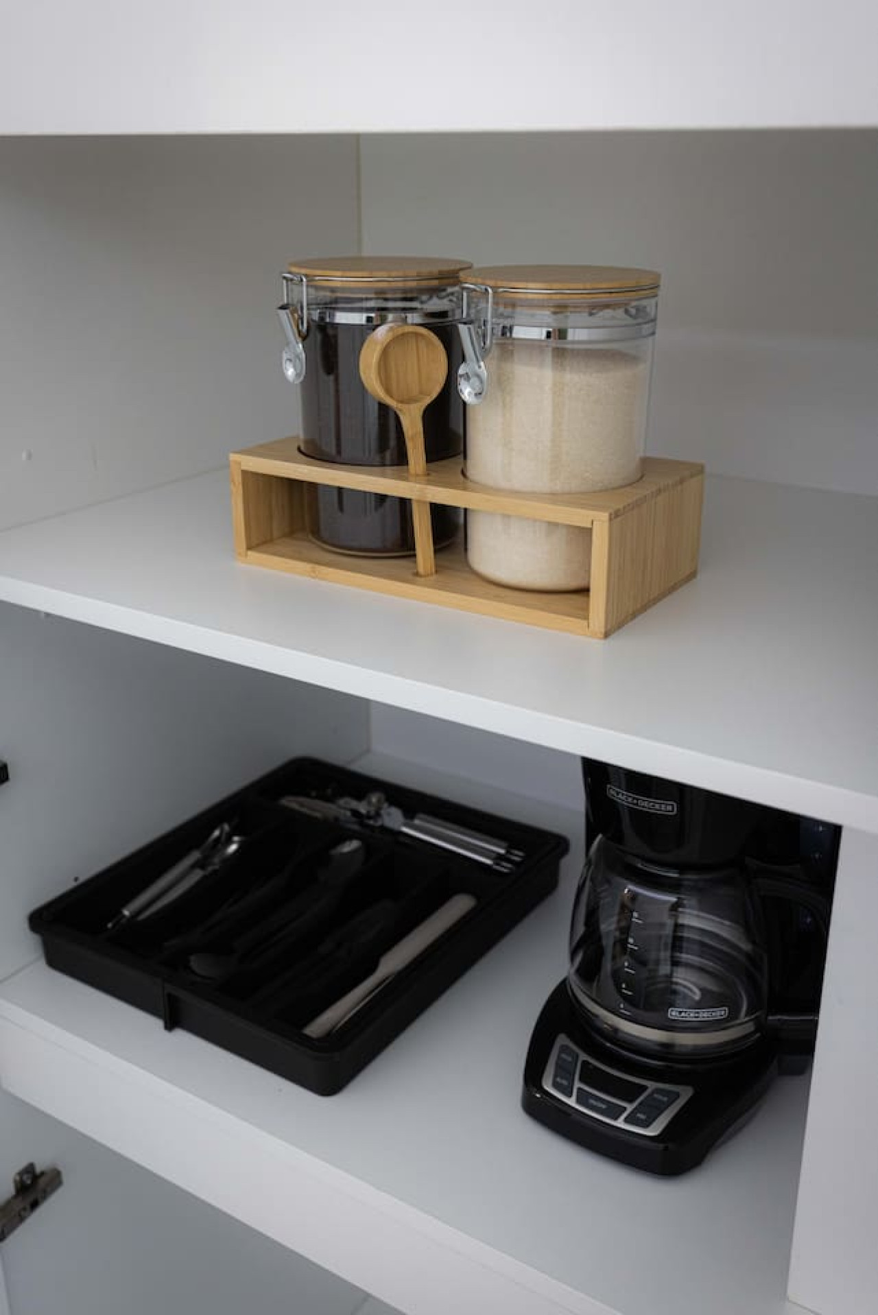 Kitchen cabinets stocked with cooking wares, glassware and silverwares, ideal for mixing up your favorite meals and drinks during your stay.