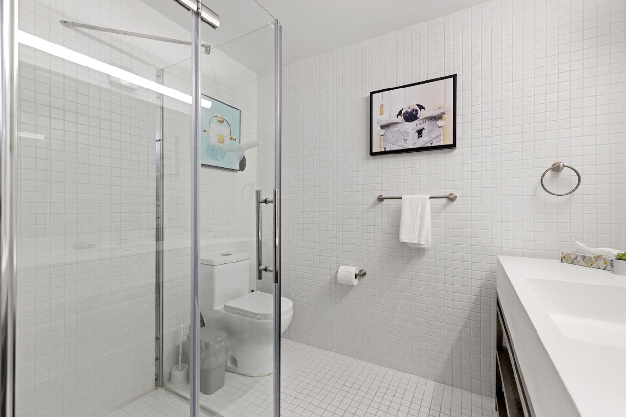 As you step into the bathroom, the clean lines and soothing colors create a space where you can relax and refresh.