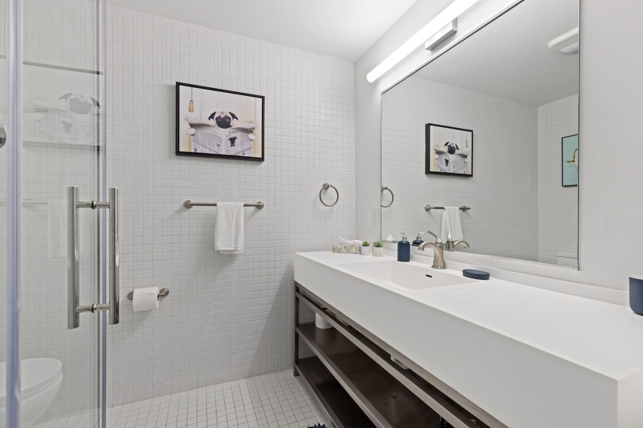 As you step into the bathroom, the clean lines and soothing colors create a space where you can relax and refresh.