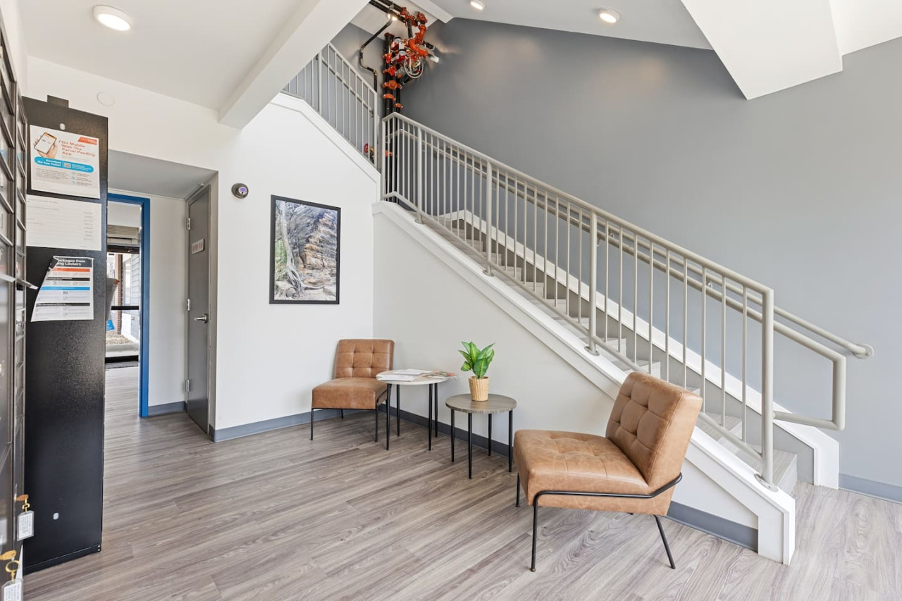 The staircase is a focal point of the home, with its graceful lines and stylish details adding to the overall charm.