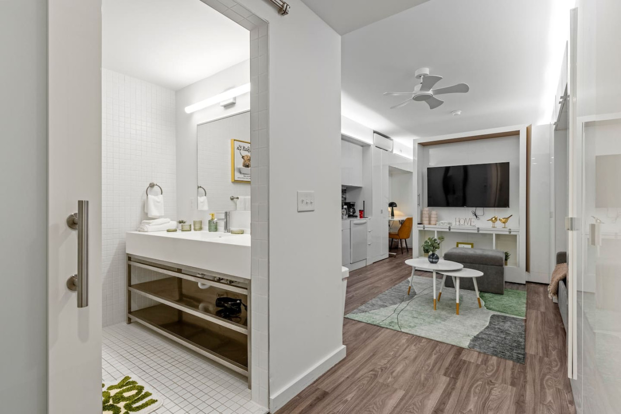 Spacious open-concept area featuring a modern furnishings, and a stylish entertainment setup—ideal for gatherings and relaxation.