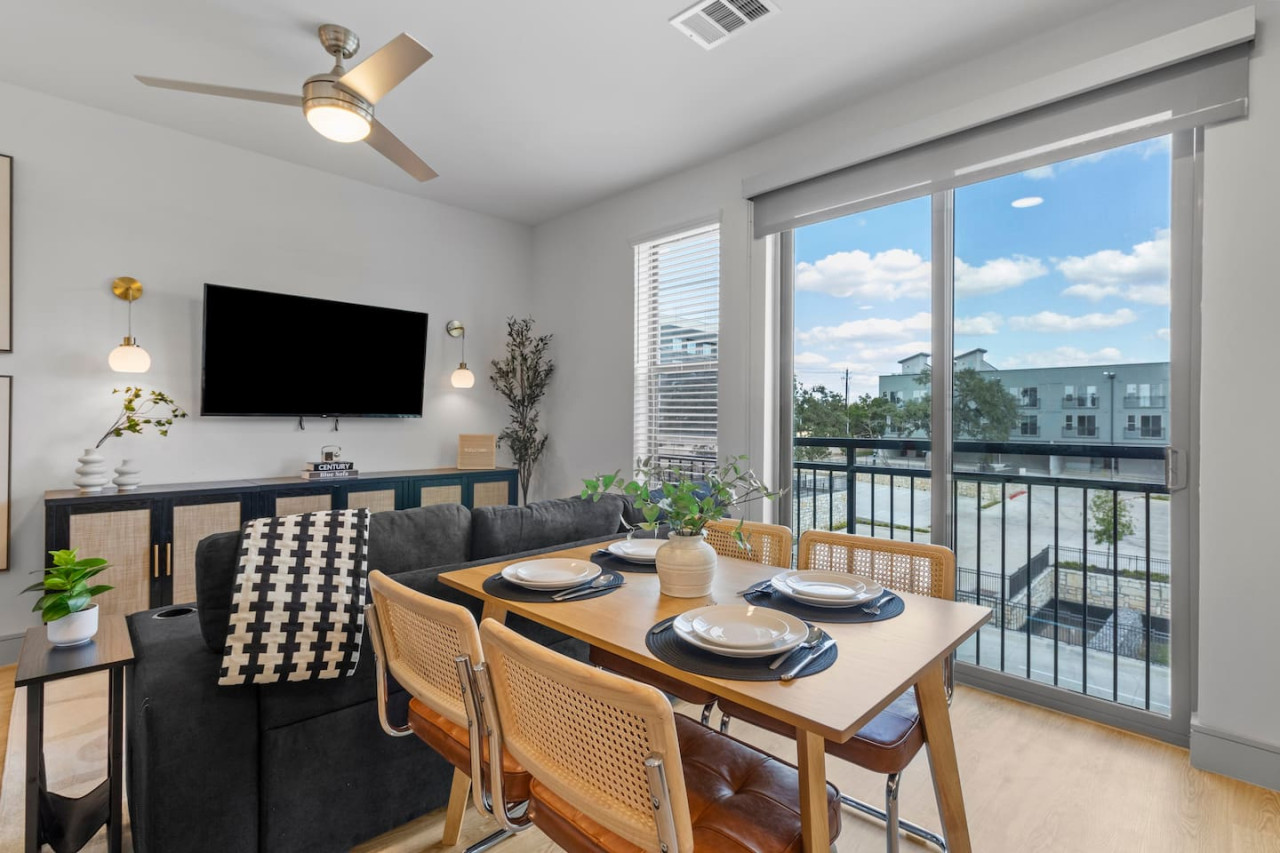 Elegant dining area with a large table and comfortable seating, perfect for gathering with family and friends for a meal.