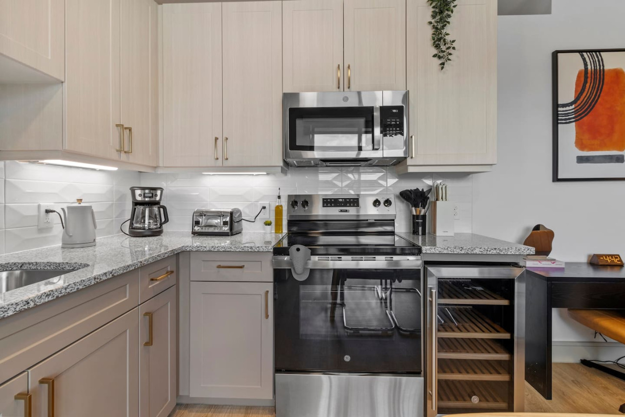 As you approach kitchen the elegant layout and well-stocked shelves make it the ideal spot to relax.