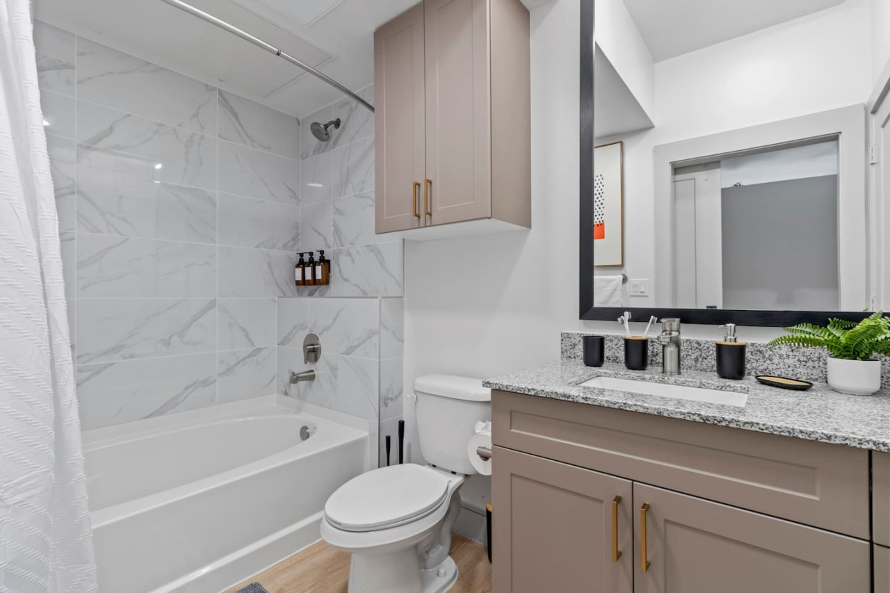 You feel a sense of calm as you enter the bathroom, where the thoughtful design and high-quality materials create a serene environment.