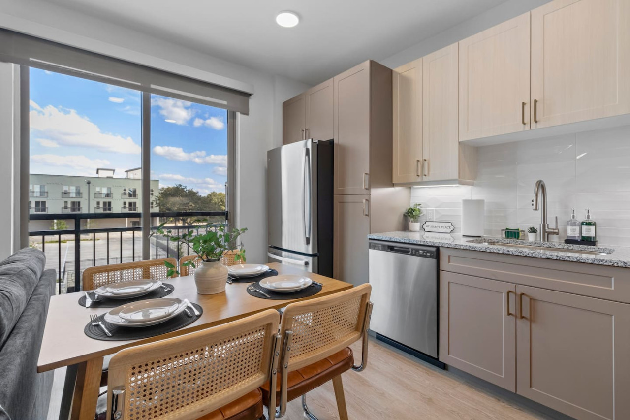Elegant dining area with a large table and comfortable seating, perfect for gathering with family and friends for a meal.