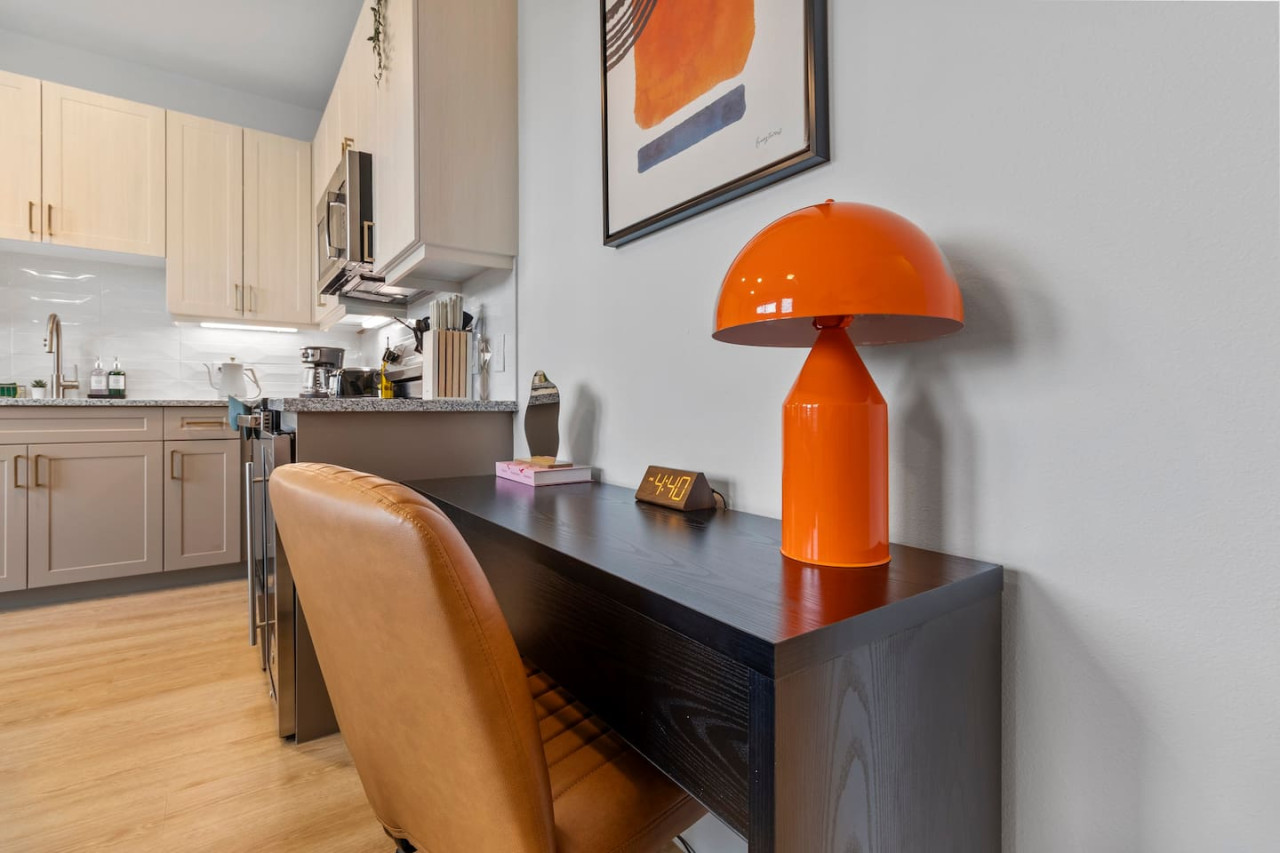 This cozy workspace area is perfect for productivity. Enjoy natural light, a comfortable chair, and a stylish desk setup. Ideal for work-from-home needs or planning your Dallas adventures.