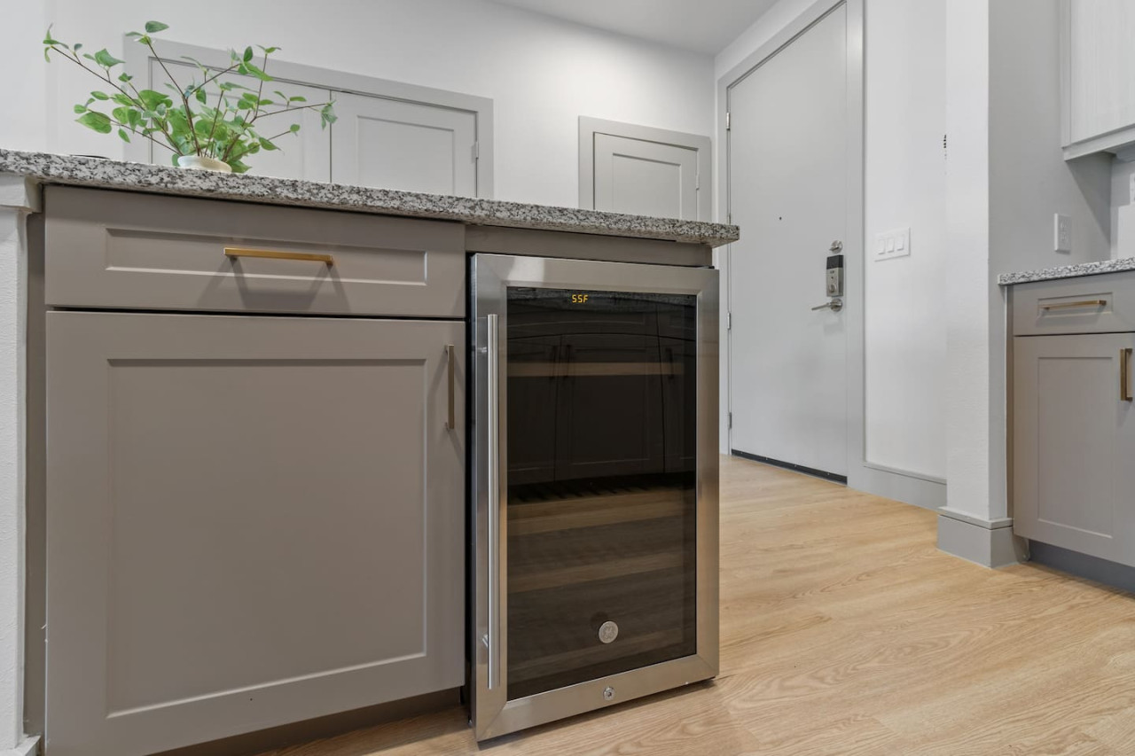 As you approach kitchen the elegant layout and well-stocked shelves make it the ideal spot to relax.