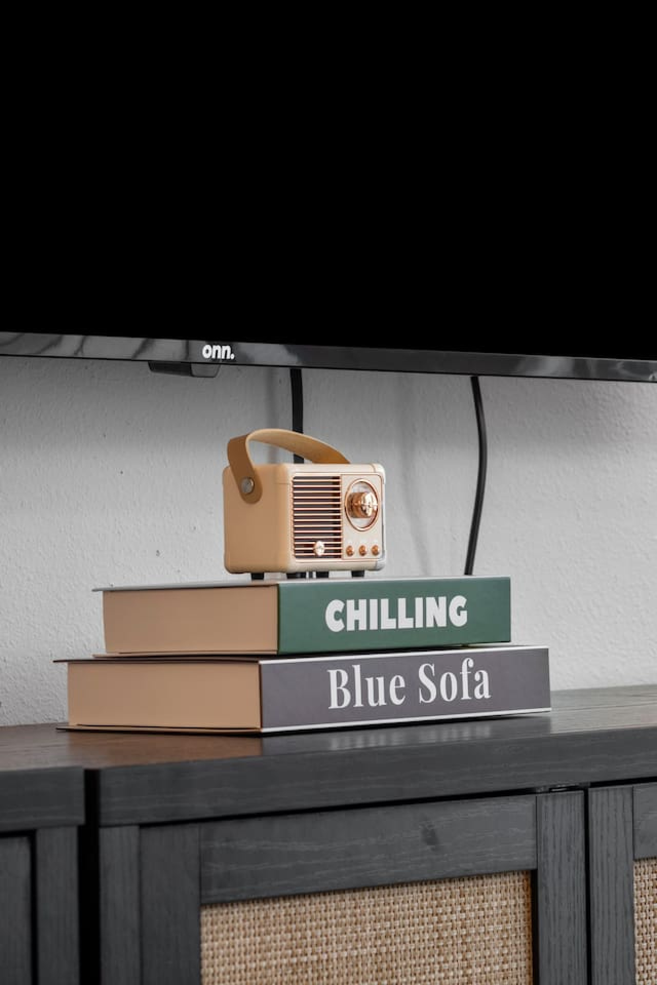 Enjoy a blend of modern comfort and style in this spacious living area. Featuring a plush sofa, chic decor, and a vibrant neon sign, it's perfect for relaxation and socializing.