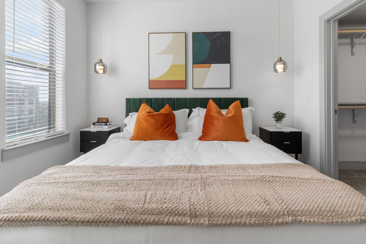 The bedroom offers a luxurious retreat, with a bed that promises restful nights and a room that feels like a private oasis.