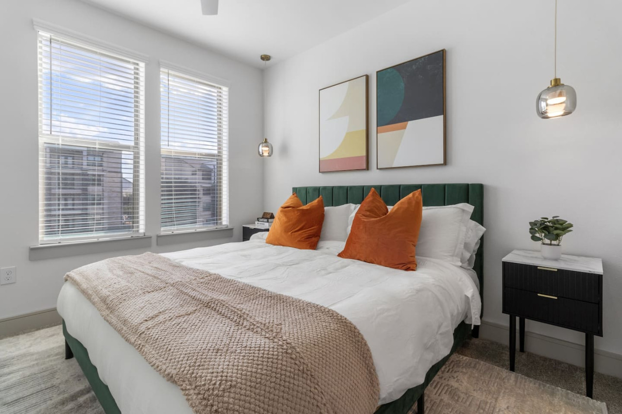 The bedroom offers a luxurious retreat, with a bed that promises restful nights and a room that feels like a private oasis.