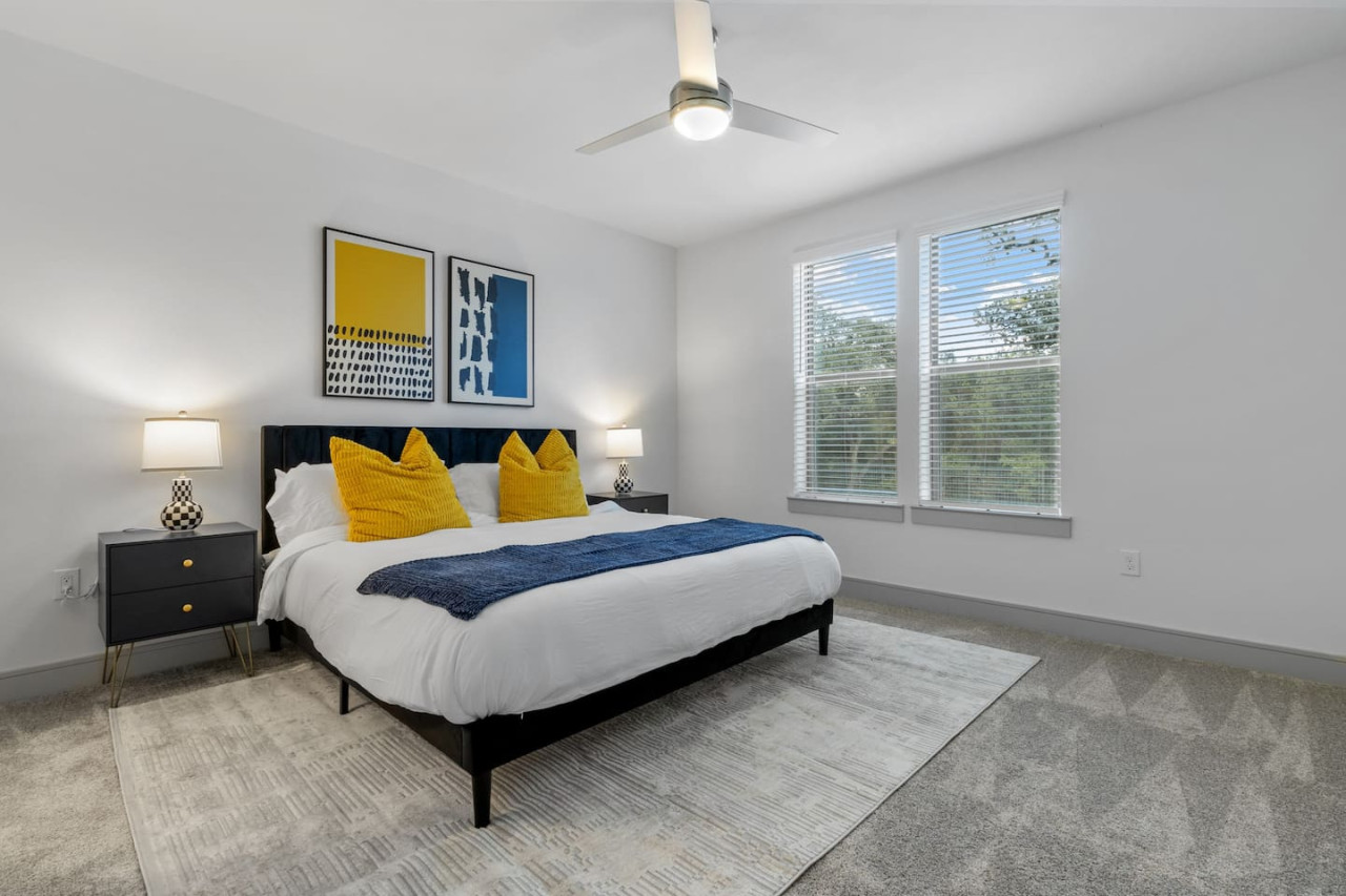 The king bedroom offers a luxurious retreat, with a bed that promises restful nights and a room that feels like a private oasis.
