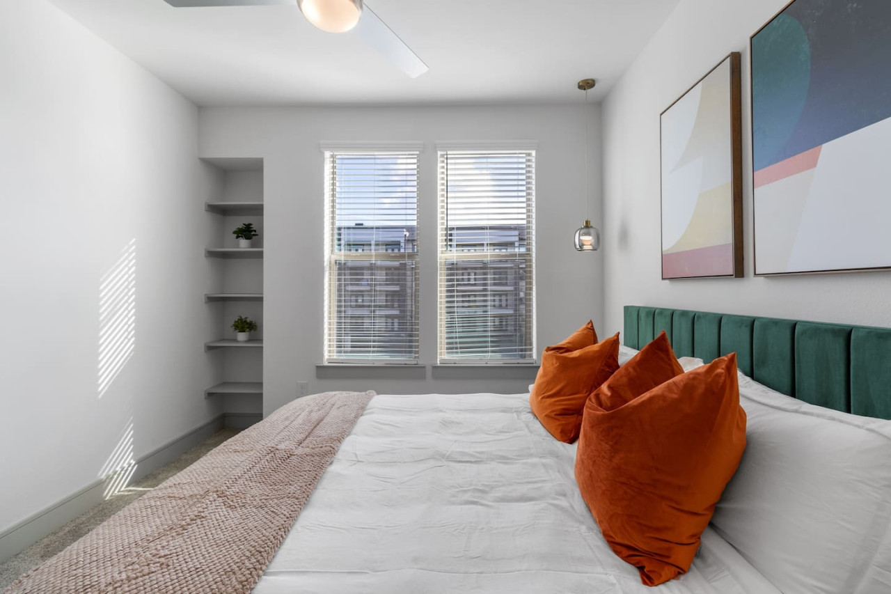 The bedroom offers a luxurious retreat, with a bed that promises restful nights and a room that feels like a private oasis.