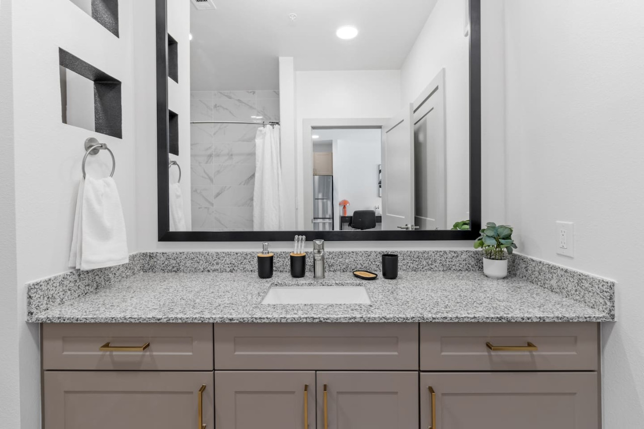 You feel a sense of calm as you enter the bathroom, where the thoughtful design and high-quality materials create a serene environment.