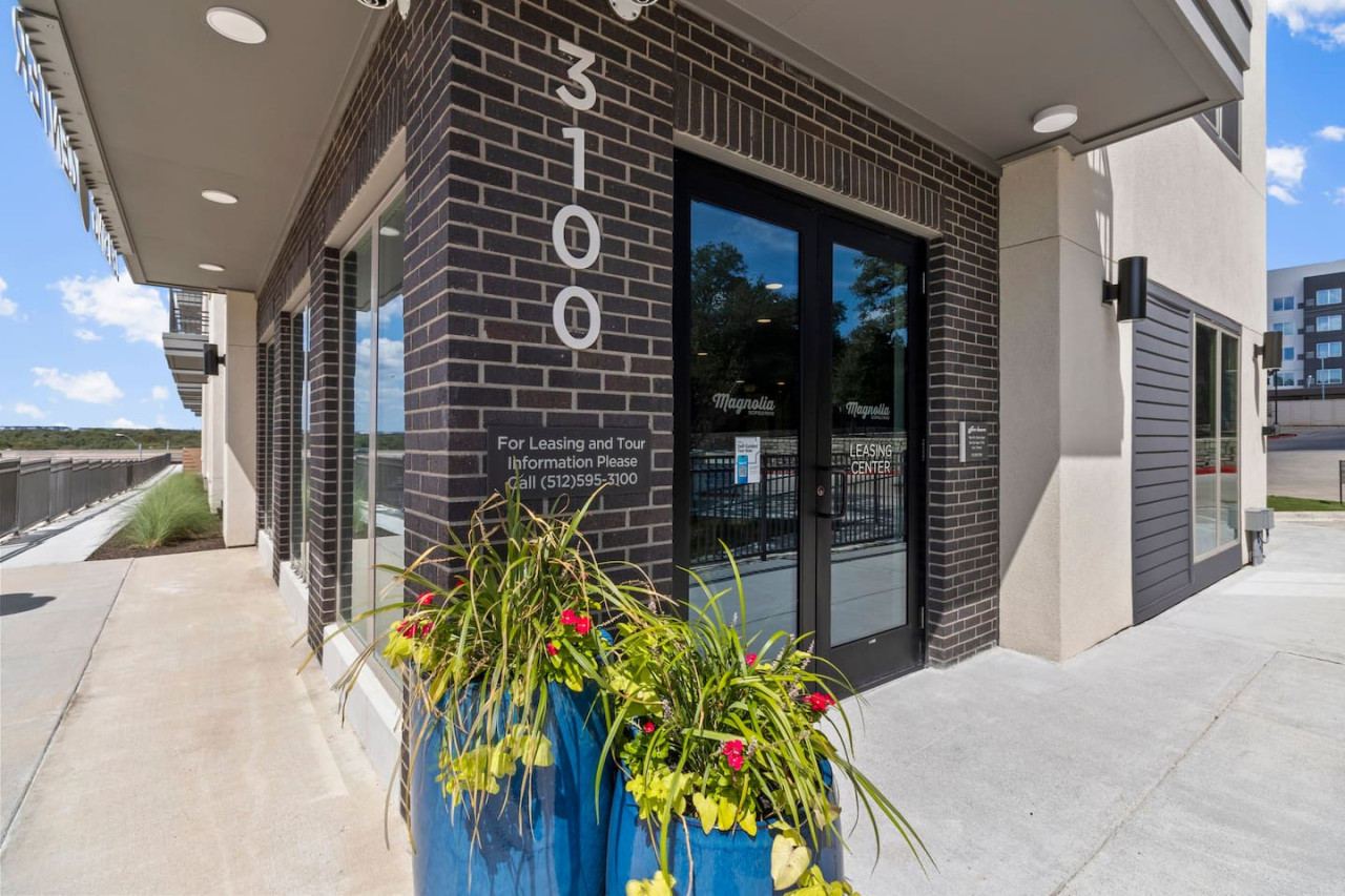 As you approach the house, the inviting entrance and beautiful exterior make you eager to explore what’s inside.