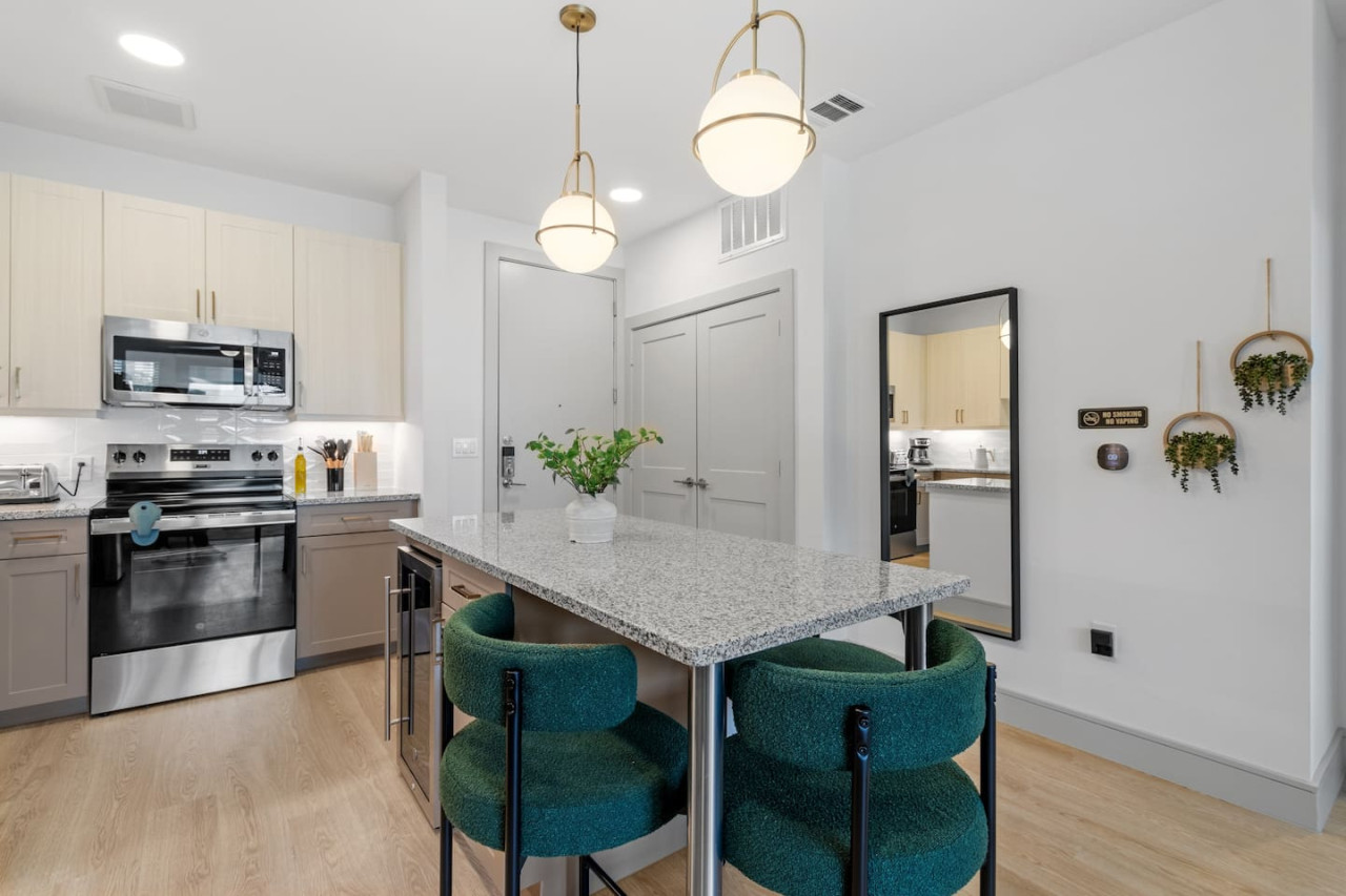 The spacious dining room invites you to savor every moment, whether enjoying a quiet meal or hosting a festive gathering.