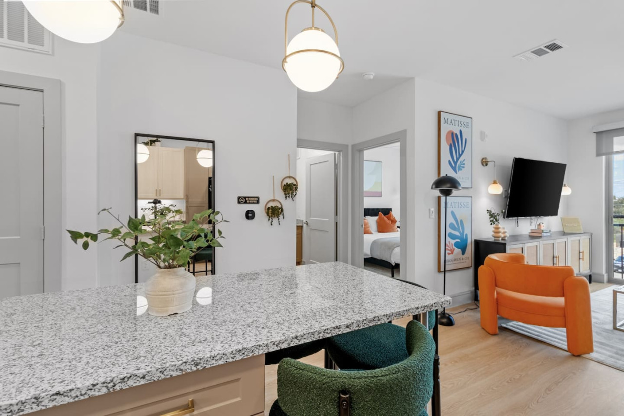 Spacious open-concept area featuring a modern furnishings, and a stylish entertainment setup—ideal for gatherings and relaxation.