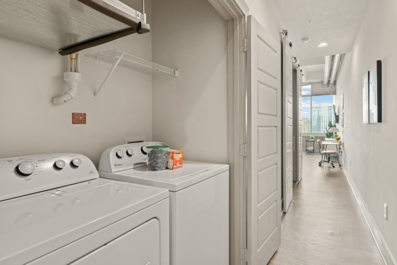 Convenient laundry room with washer, dryer, and all necessary supplies, making it easy to take care of your laundry needs.