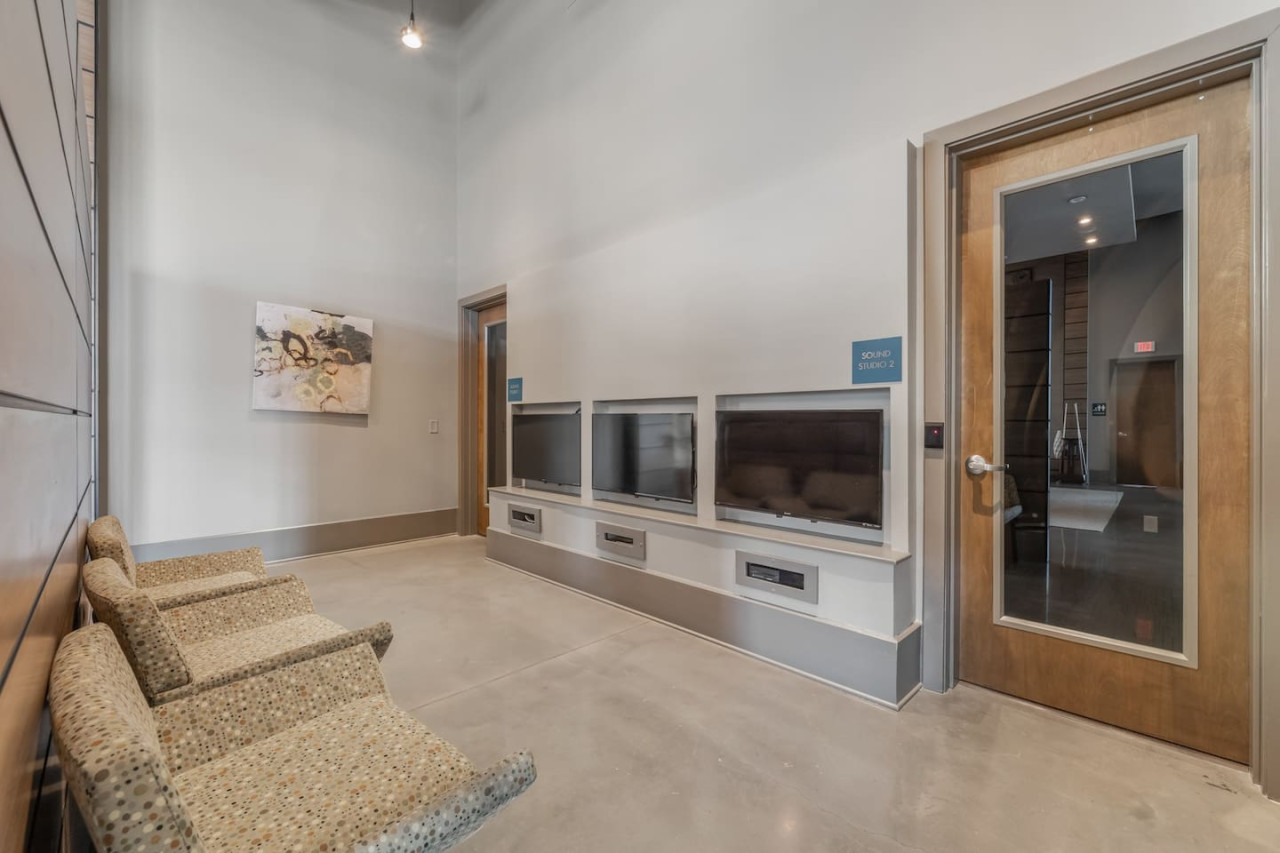 You feel at home as you settle into the living room, where the inviting atmosphere is perfect for lounging or entertaining.