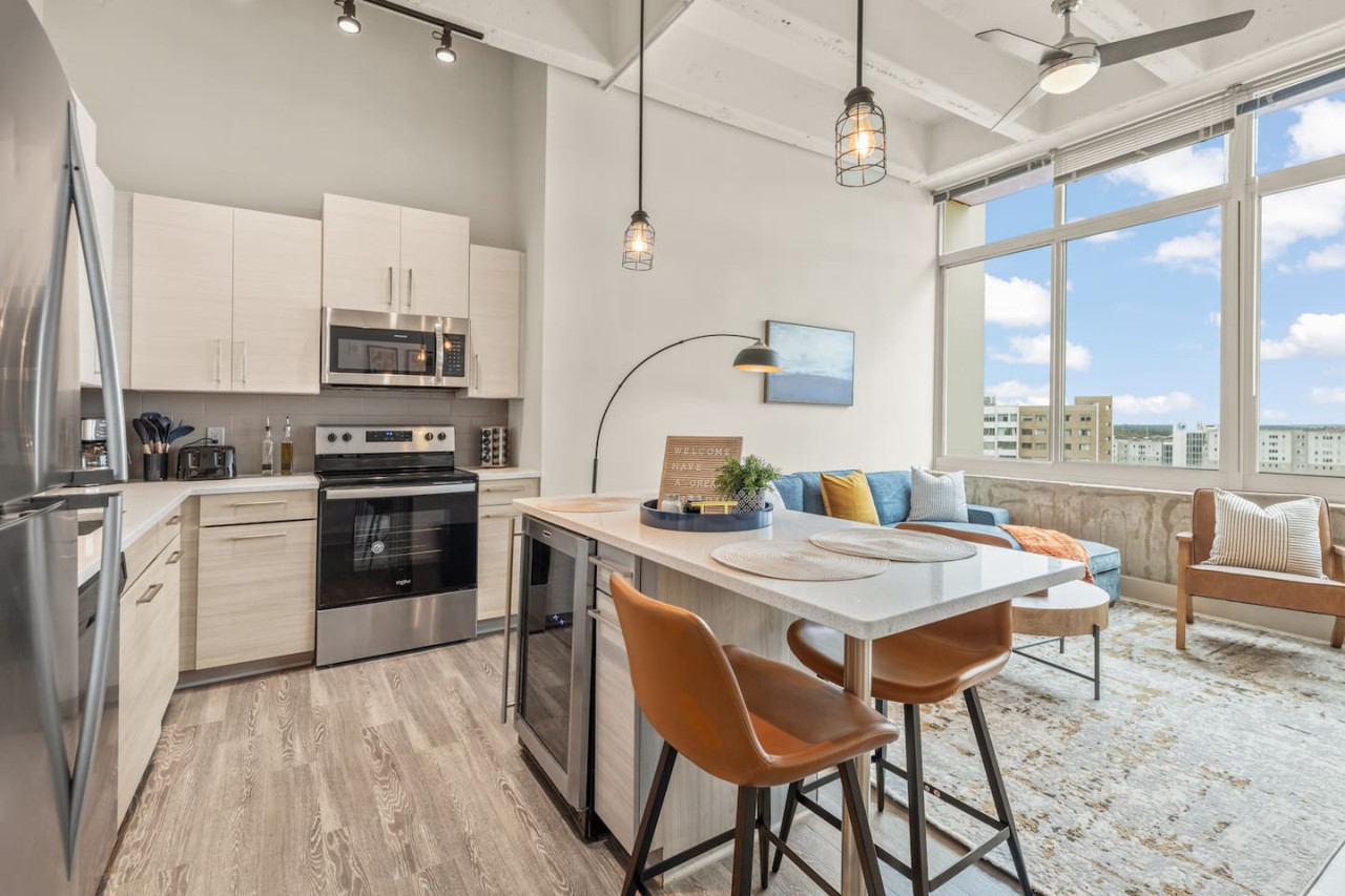 The dining room is bathed in natural light, creating a bright and inviting space where every meal feels special.