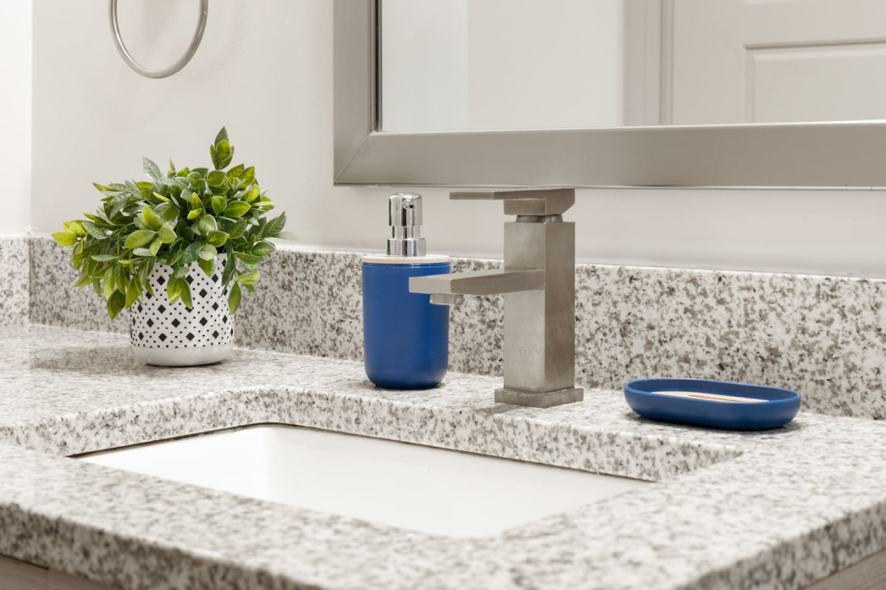 You feel a sense of calm as you enter the bathroom, where the thoughtful design and high-quality materials create a serene environment.