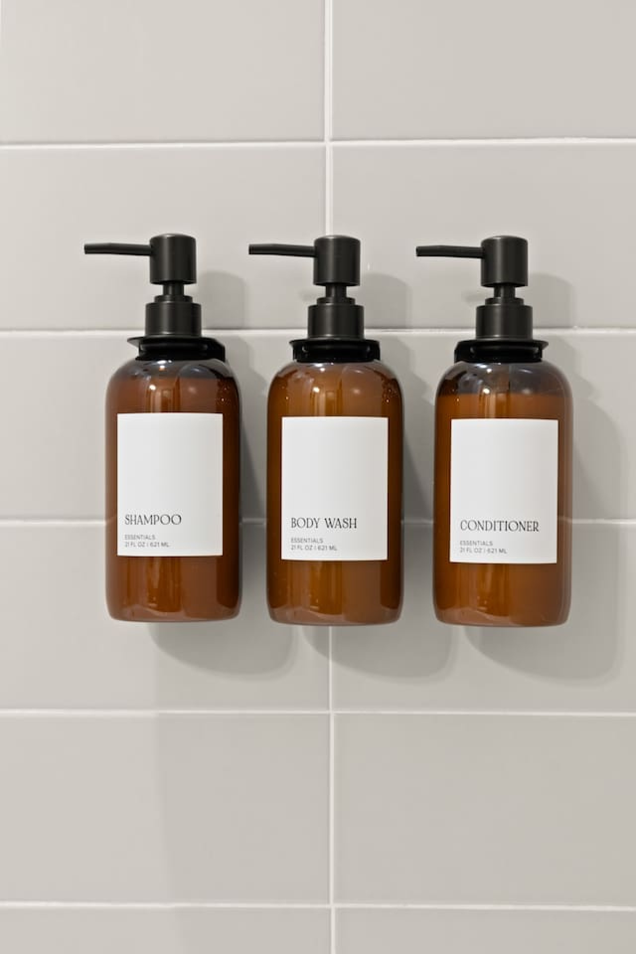 Immaculate bathroom featuring a spacious shower, fresh towels, and complimentary toiletries for a spa-like experience.