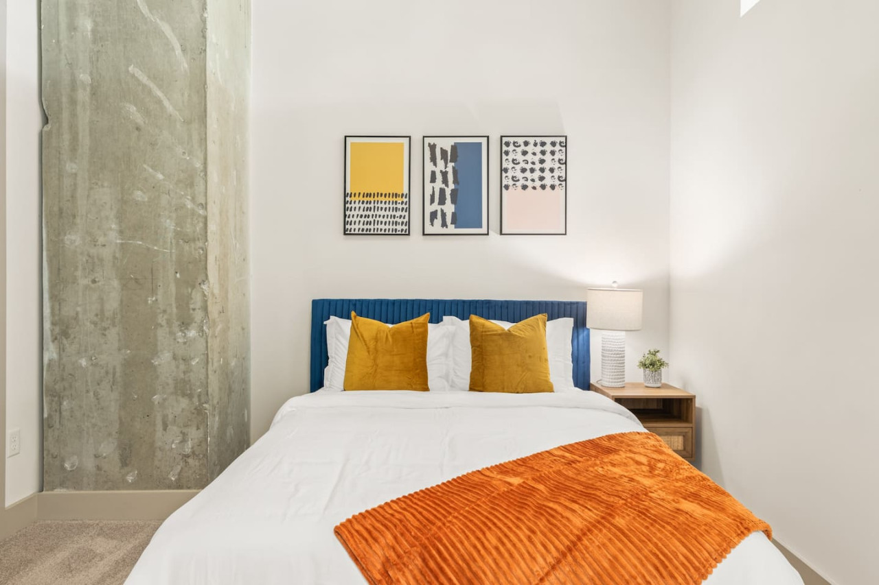 The bedroom’s serene ambiance invites you to relax, with a plush bed that promises a restful night's sleep.