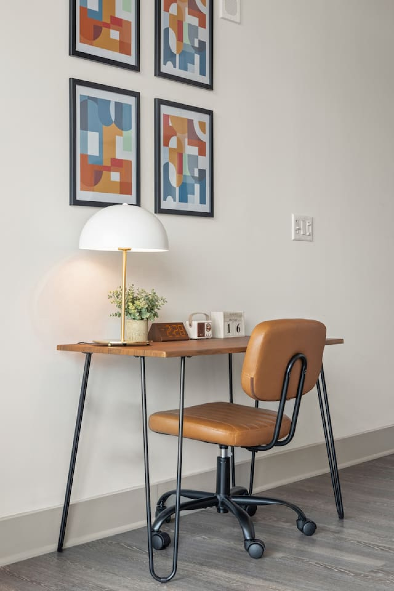 This cozy workspace with warm lighting, and a creative wall display, perfect for productivity.