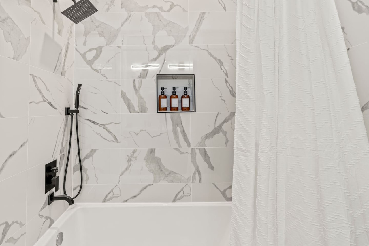 You feel a sense of calm as you enter the bathroom, where the thoughtful design and high-quality materials create a serene environment.