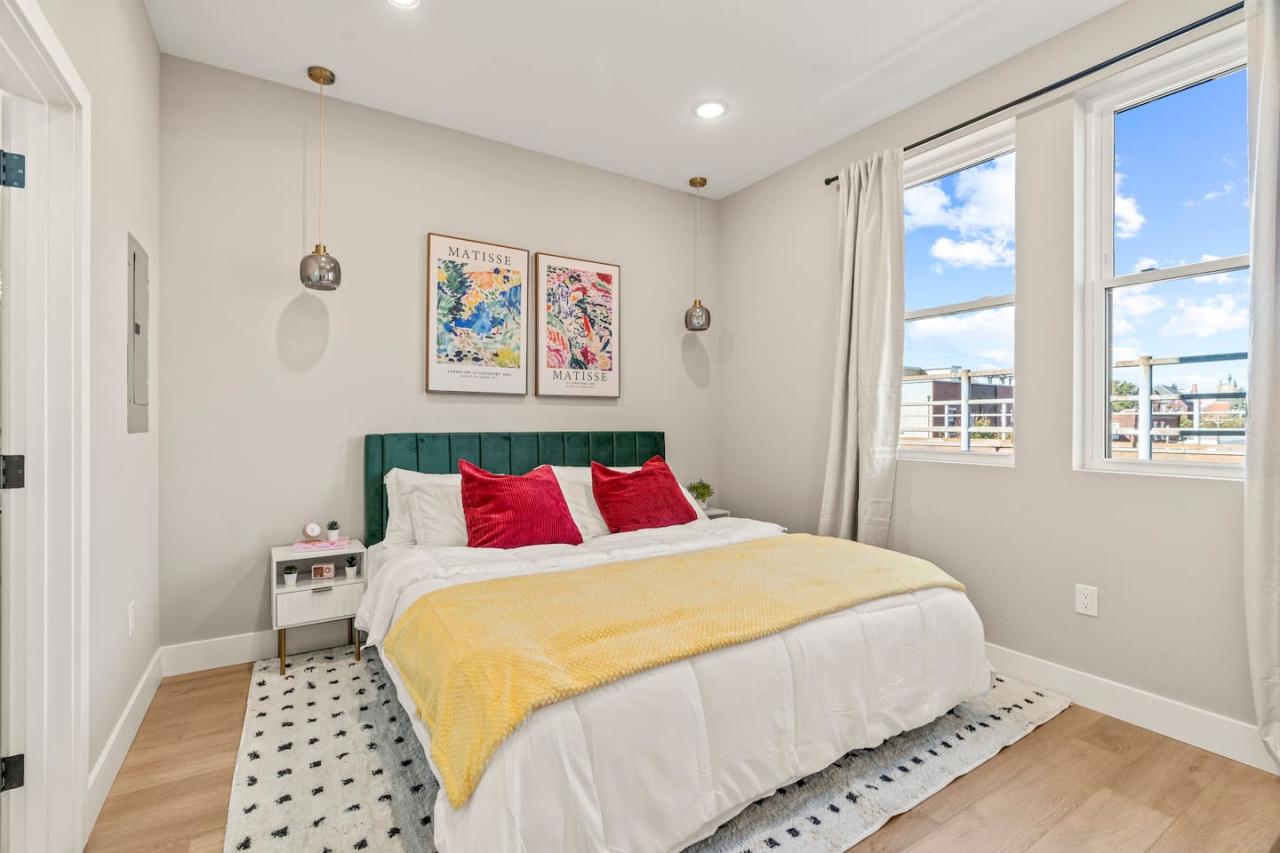 You feel enveloped in comfort as you relax on the queen bed, surrounded by a room designed for tranquility.