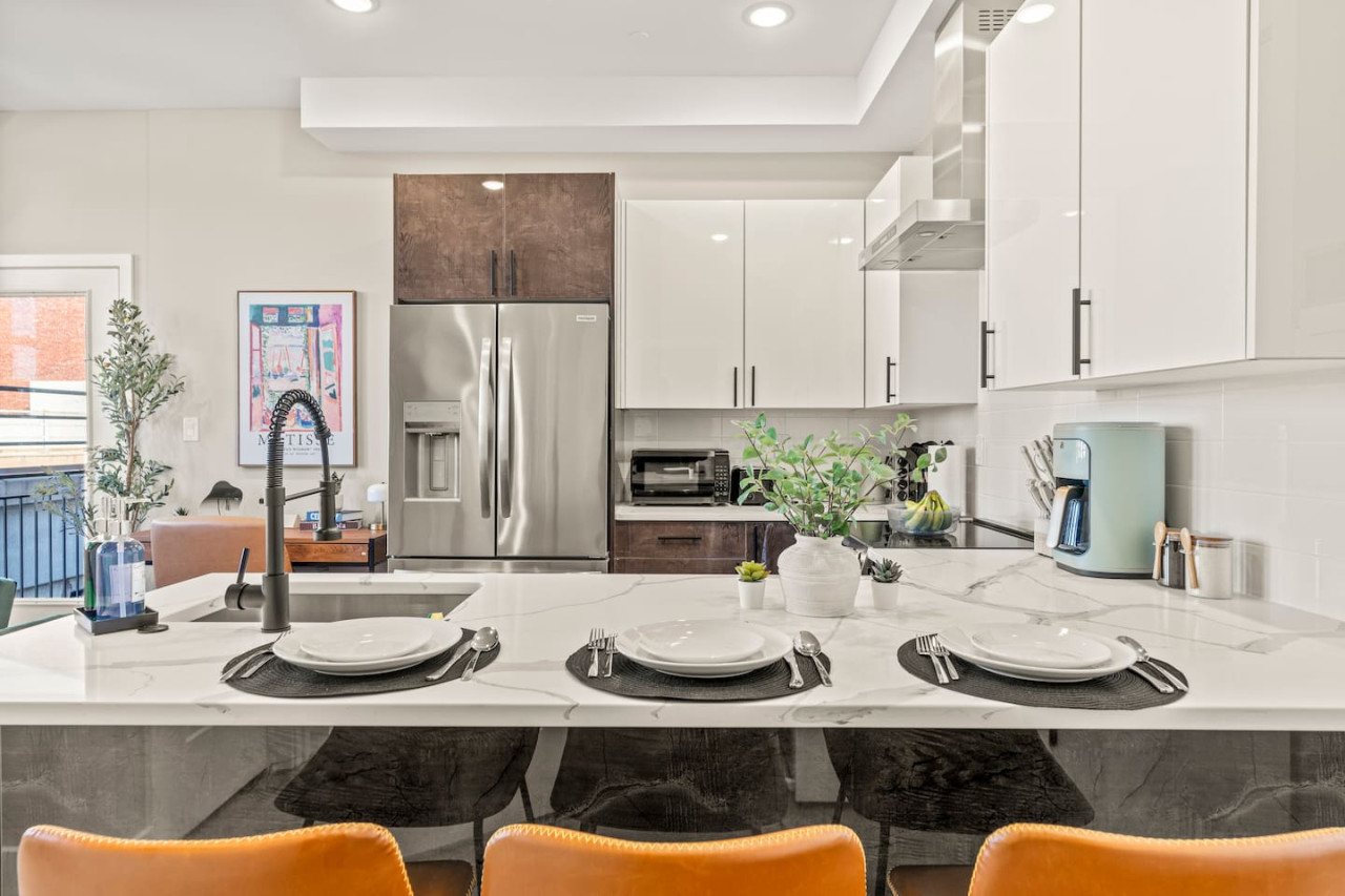 Set the table for memorable meals in this beautifully arranged dining area. With elegant place settings and a charming centerpiece, it's perfect for hosting dinner parties or enjoying family dinners in a cozy and stylish atmosphere.