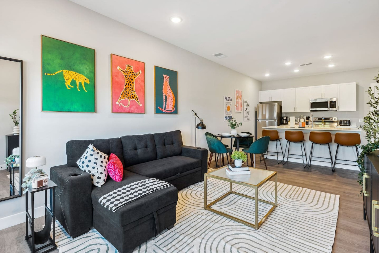 Spacious living room with stylish decor, perfect for unwinding after a day of exploring the local area.