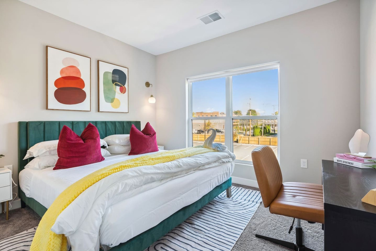 The queen bedroom’s stylish design and comfortable bedding create a perfect sanctuary for restful nights.